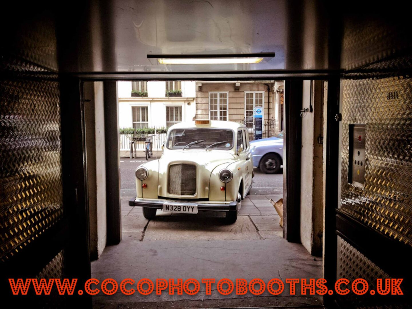 london taxi from coco photo booths entering the famous lift
