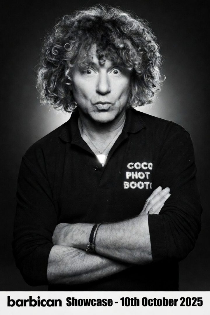 leo ferenc posing with his glam photo booth with backlighting in london