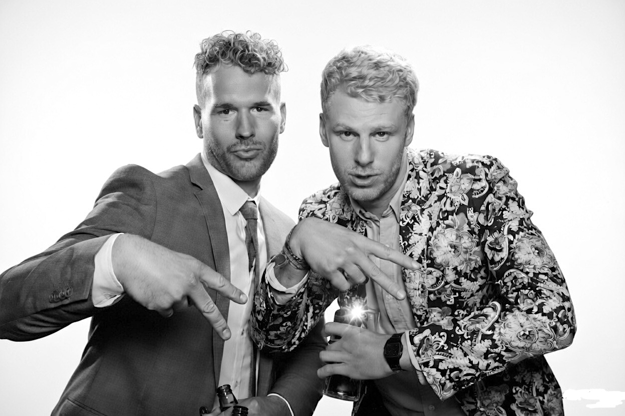 two men in a coco photo booths glam style kardashian picture